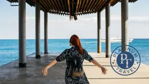 Woman Walking under Pier. Book this trip with Platinum Travel.