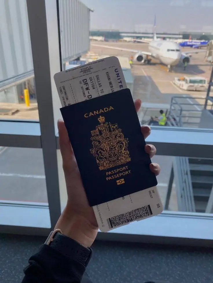 Traveler Holding Up Thier Passport and ticket.