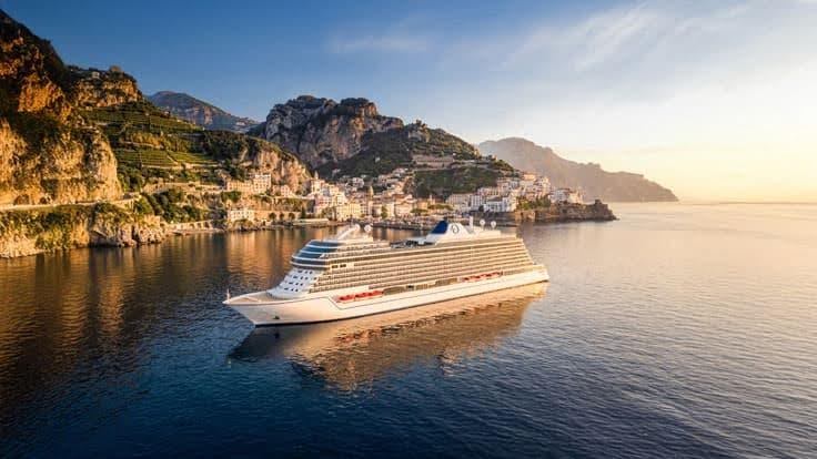 small ship cruise in secluded harbor at sunrise